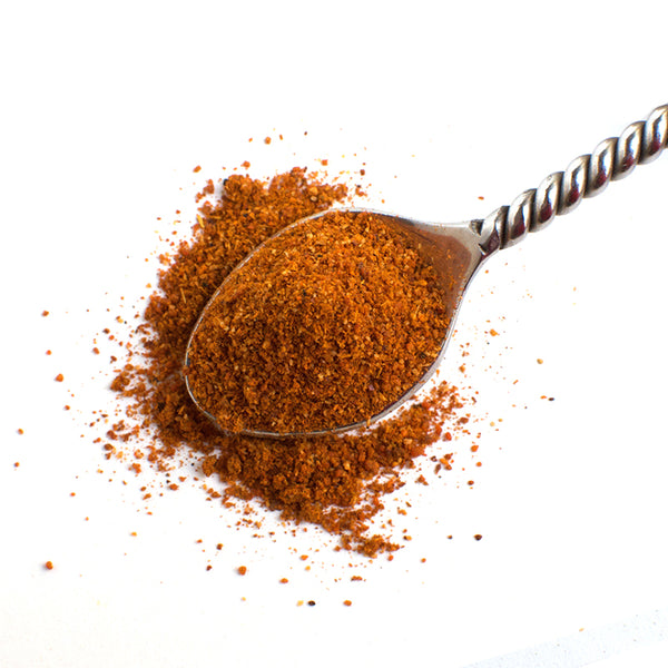 Aromatic Spice Blends Hot Tunisian Harissa spice blend closeup on spoon