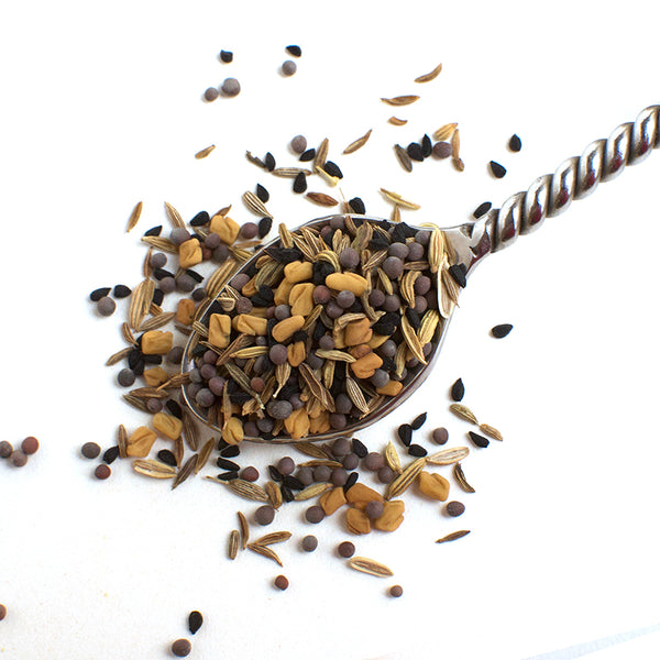 Aromatic Spice Blends Panch Phoran spice blend closeup on spoon